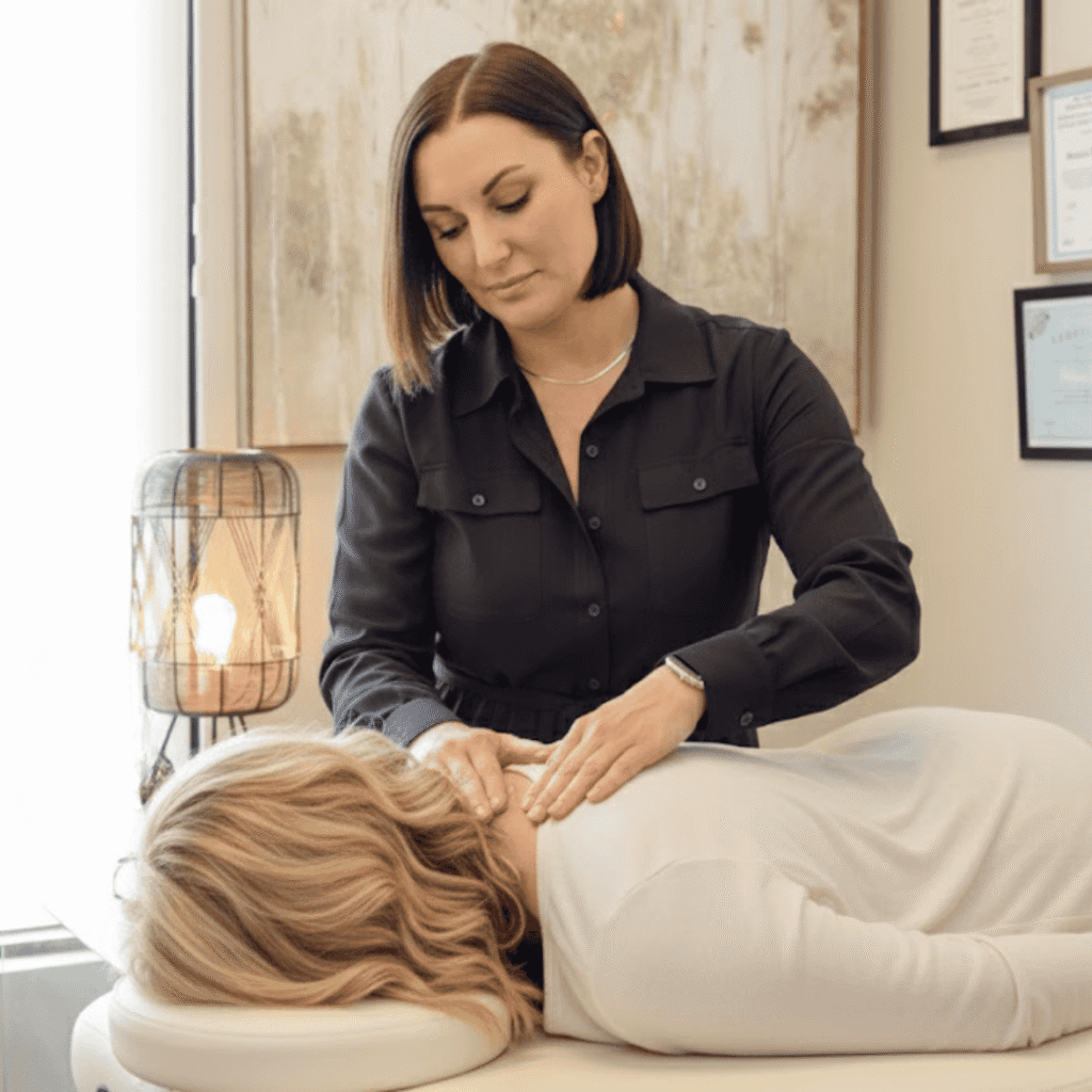 Sooner practicing Healing Touch on neck
